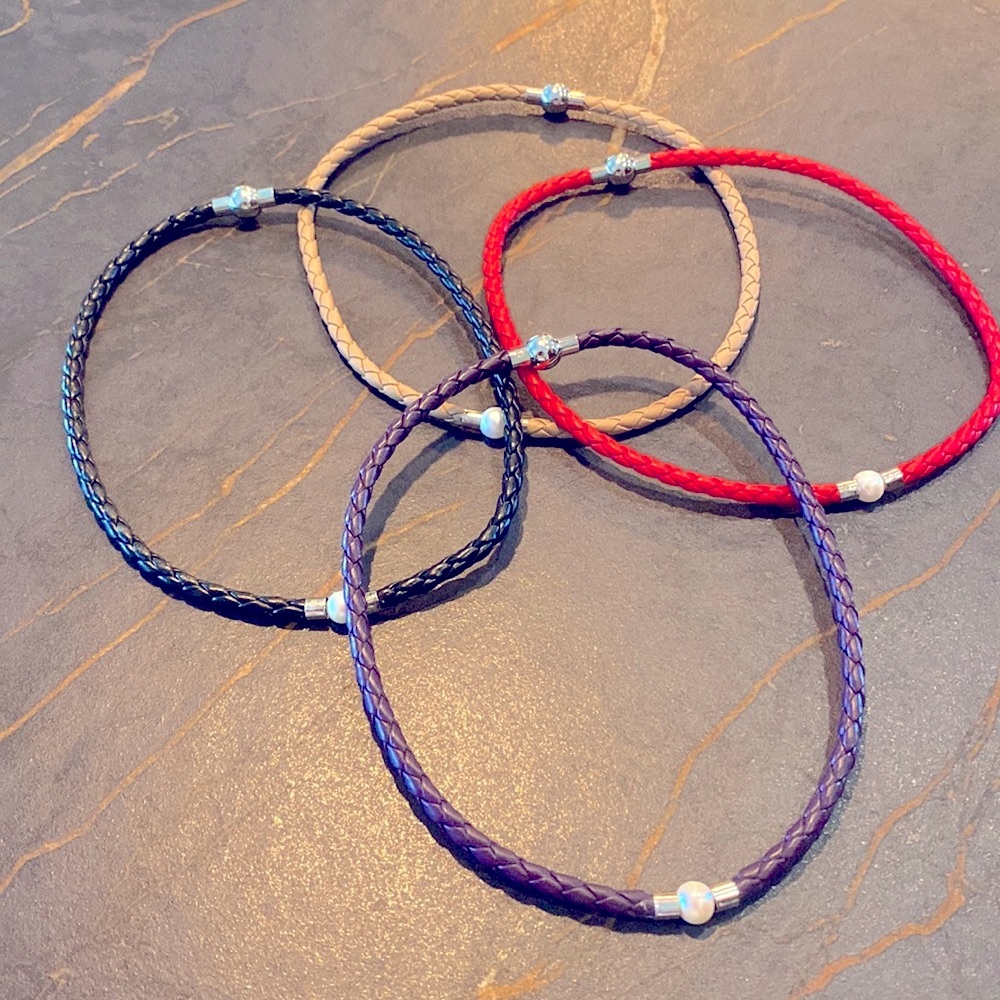 Bundle of 4 choker pearl and vegan leather necklaces. Marked 925 next to pearl.